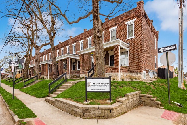 Front Exterior - The Courtyard on South Champion Apartments