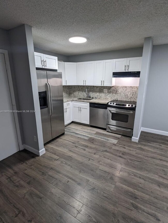 Building Photo - 10769 W Clairmont Cir Unit 102 Rental