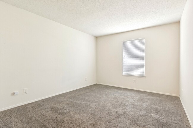 Inviting spaces with plush carpeting and window blinds for privacy and comfort, professionally operated by Highlands Vista Group.