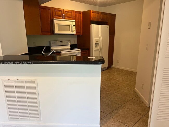 Photo - 8821 Wiles Rd Unit 306