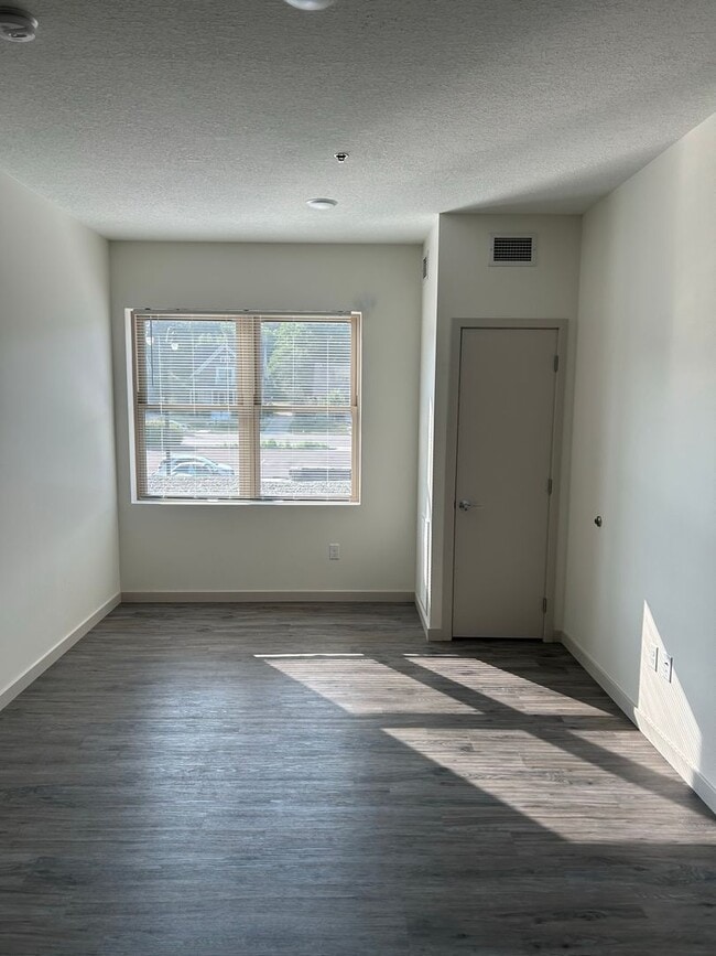 Building Photo - One-Bedroom Unit 207