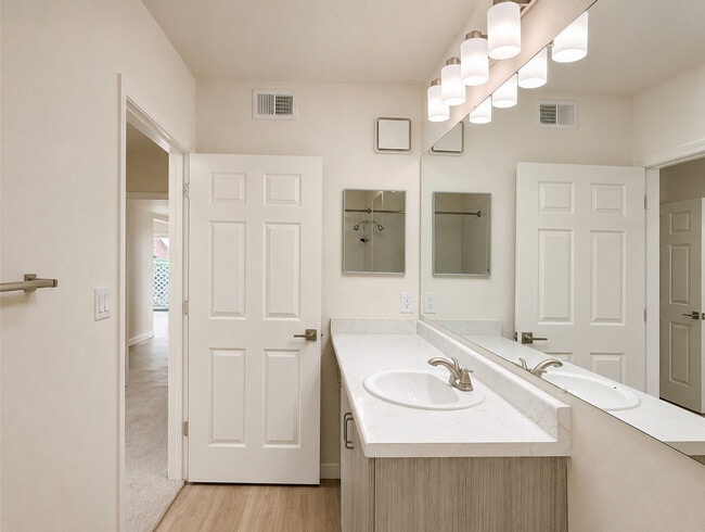 Renovated: Italian cabinetry and bright bathroom lighting. 5601 Taylor Ranch Rd NW, Albuquerque