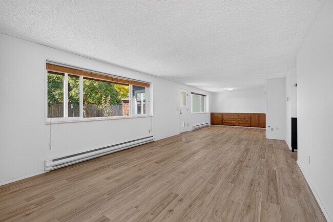 Sprawling 1 bedroom with Parking, Private Yard, Fireplace, & in-unit laundry
