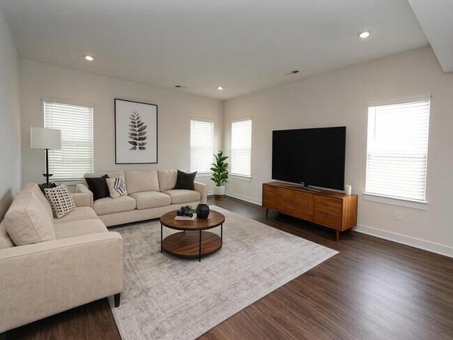 Photo - This wonderful home has a covered rocking chair front porch