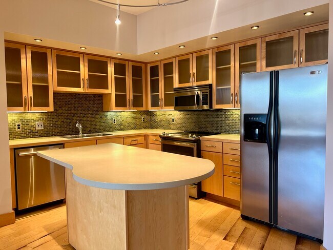 Kitchen with Island - 319 Broadway N Unit 205