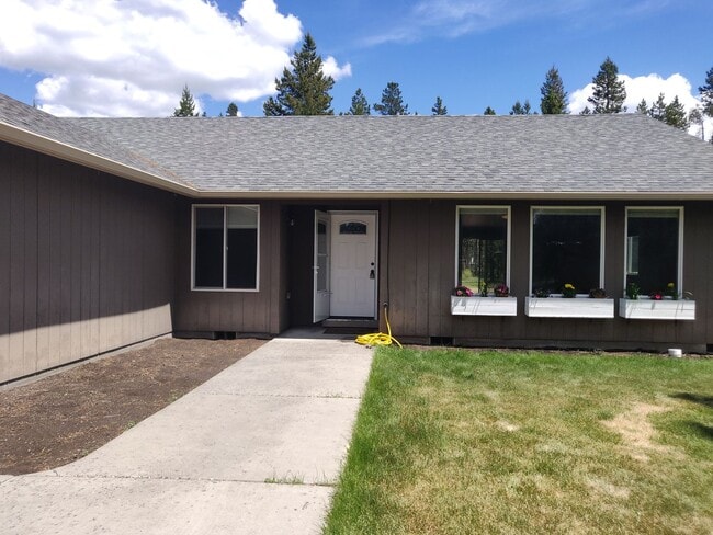 Photo - Charming 4-Bedroom Home on 1/2 Acre with a Fenced Backyard, Fully Insulated Double-Car Garage, in...