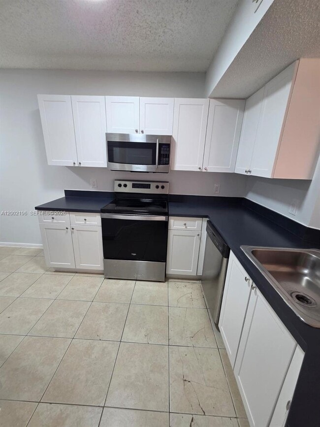 Photo - 8871 Wiles Rd Unit 208