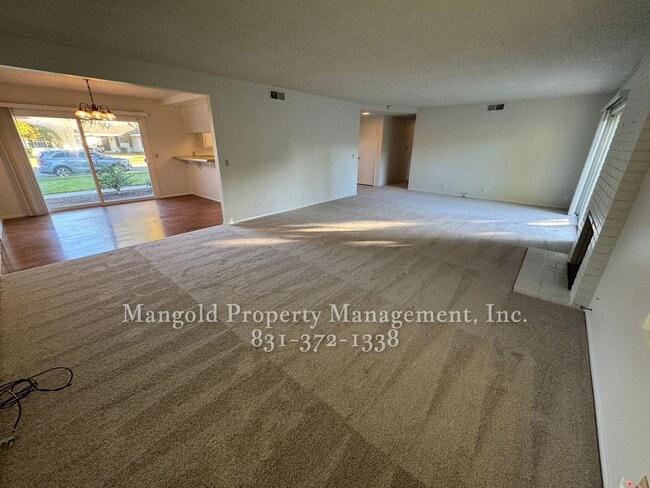 Photo - Beautiful 4-bed 2-bath Home with Cozy Fireplace and Large Backyard!