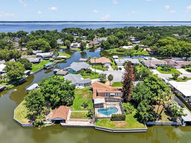 Photo - Available Now! Unique Canal-Front Pool Home with Boathouse & Chain of Lakes Access