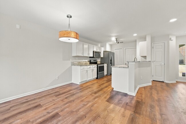 Updated kitchen opens directly to the main living and dining areas.