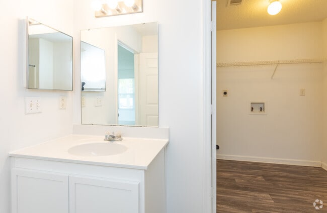 One Bedroom Downstairs Bathroom and Laundry Room - Granville Oaks Apartment Homes