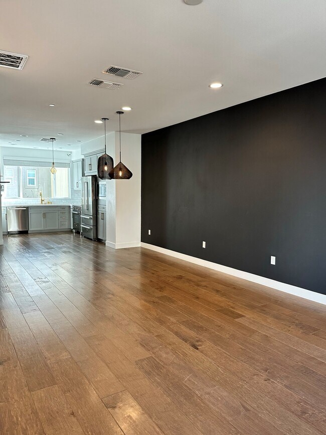 First floor looking toward dinning room and kitchen - 158 Uptown Cir Unit 158