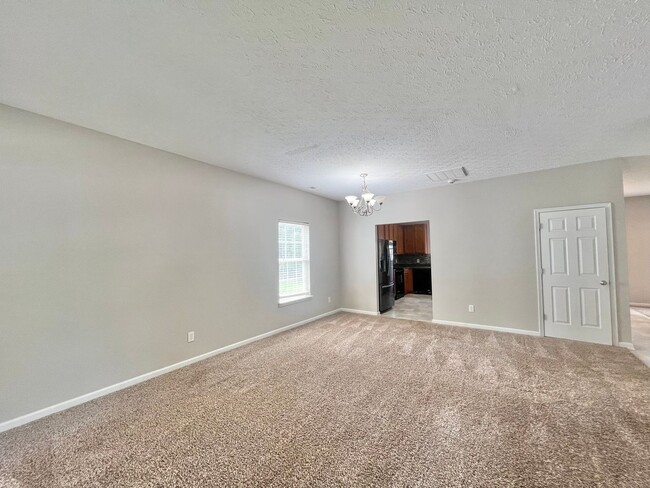 Photo - Charming 4BD, 2.5BA Durham Home with a Bonus Sun-Room & Fenced In Yard Only 10 Minutes Away from ...