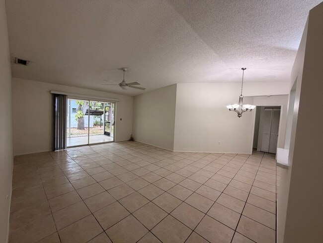 Photo - Centrally located 3/2 with 2 car garage. Pet friendly with fenced in backyard. Lawncare included.