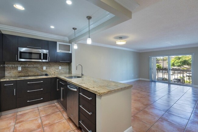 Building Photo - 7701 Camino Real Unit A202