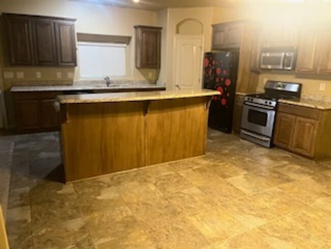 Photo - Spacious & Stylish 4-Bedroom Home with 3-Car Garage