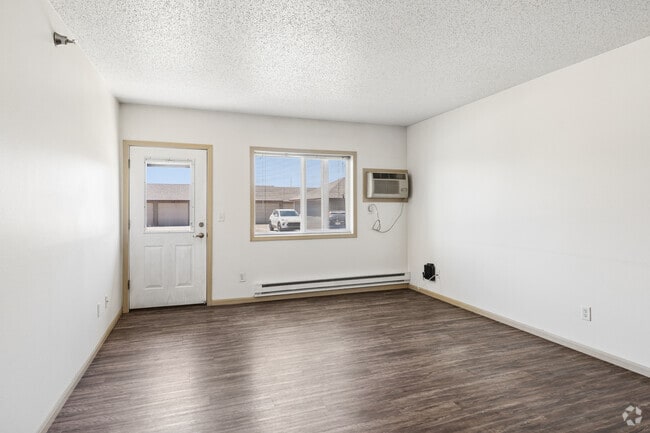 4BR, 3BA - 1,470SF - Living Room - Dakota Crossing Apartments