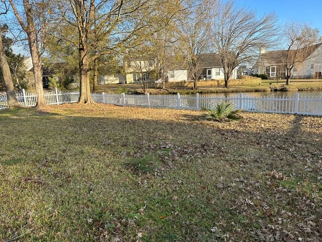 Photo - 3 x 2 with garage and pond view