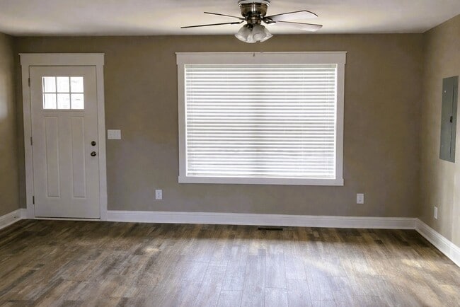 Open-concept living area with luxury luxury vinyl plank(LVP) flooring - 111 Buster Ln