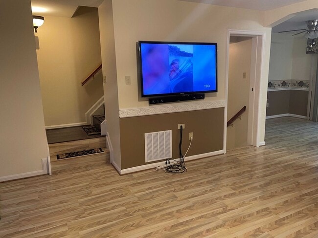 Photo - Spacious 3BR Townhome with Walkout Basement, Deck, Fenced Yard, Central A/C + Assigned Parking