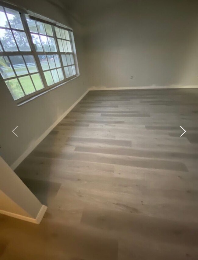 Photo - Available NOW! NEW FLOORS AND PAINT! Lovely 3/2 in Poinciana! HUGE fenced yard and NO CARPET!