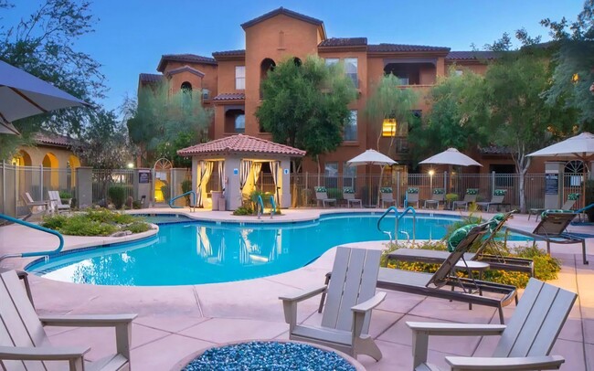 Relaxing Pool Deck with Lounge Chairs and Evening Ambiance - Desert Parks Vista Rental