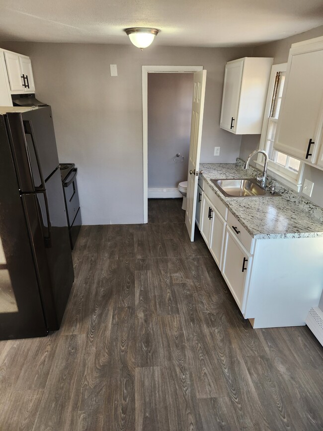 Kitchen and Half Bathroom - 14 Arlington Rd Townhome