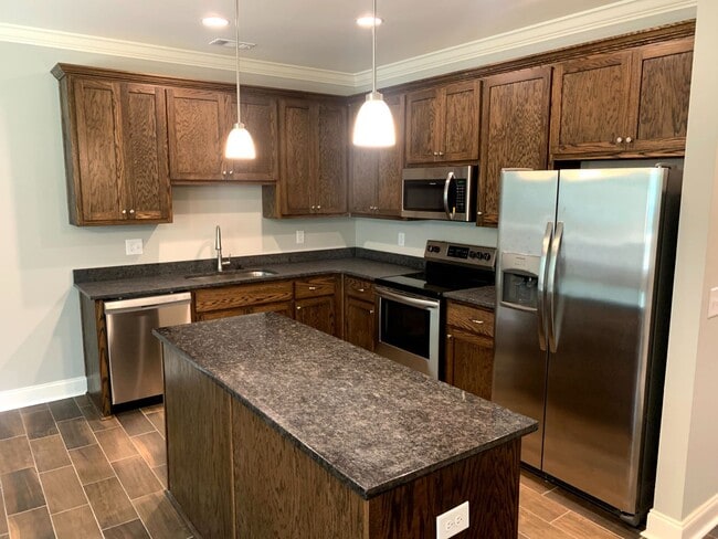 Photo - Convenient 3BR/2BA Townhome with Garage & Lawn Care Included