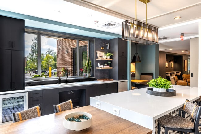 Designer clubhouse kitchen and gathering spaces at The Elmwood Apartments.