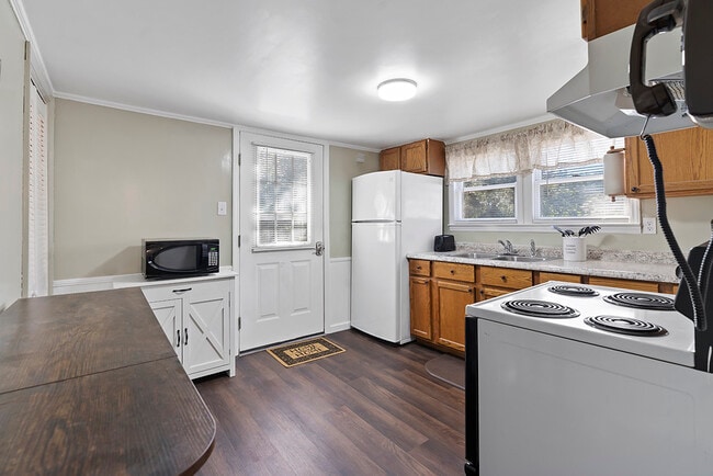 Enter house into kitchen