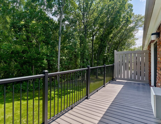 Enjoy peaceful wooded views from your private balcony at Maple Terrace Apartments in Maple Shade, NJ