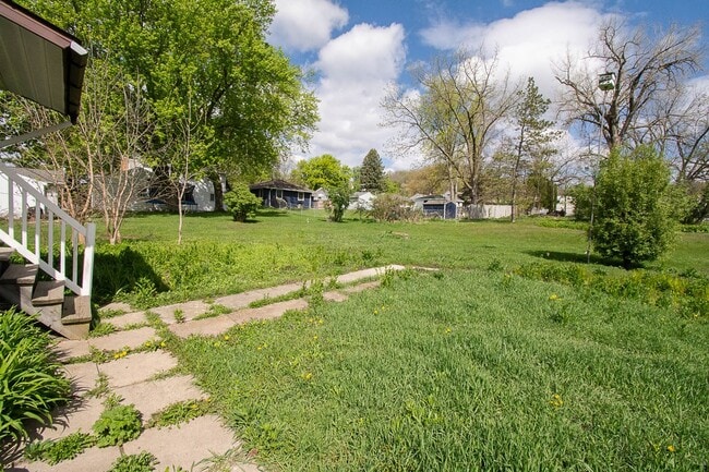 Photo - Bright, beautiful home with 3 garage spaces & tons of storage!