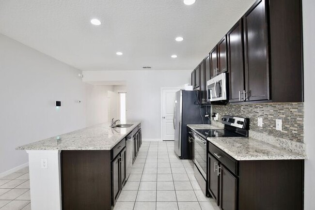 Photo - Stylish 4/3 Home with Covered Patio & Gara...