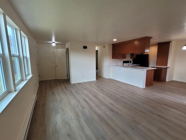Entry closet, lots of natural light in living room. - 1045 S Jasper St Unit #a
