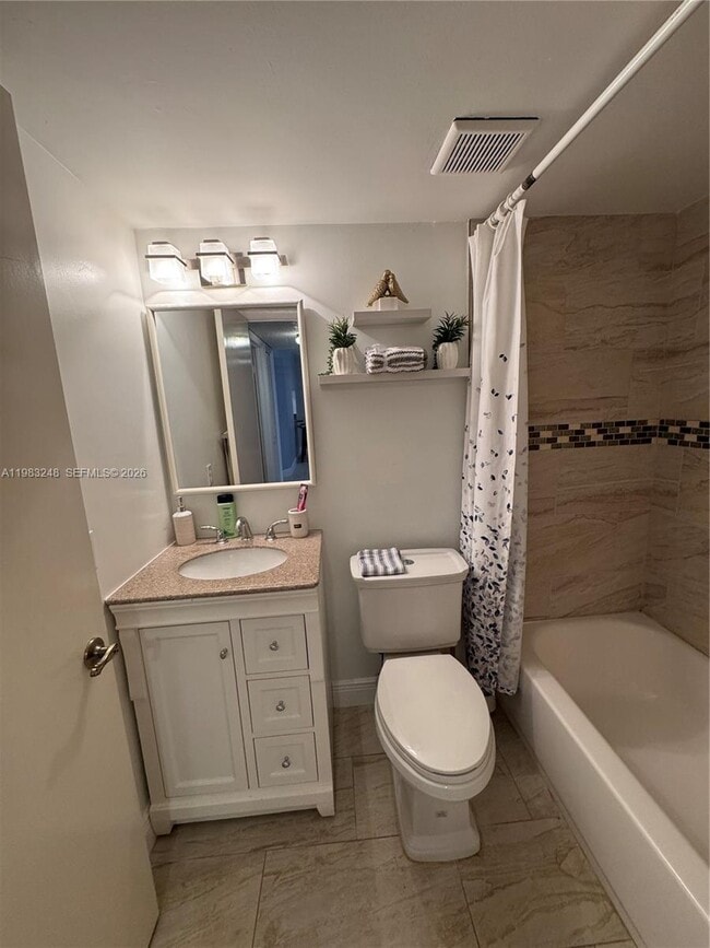 Building Photo - 6095 N Sabal Palm Blvd Unit 104