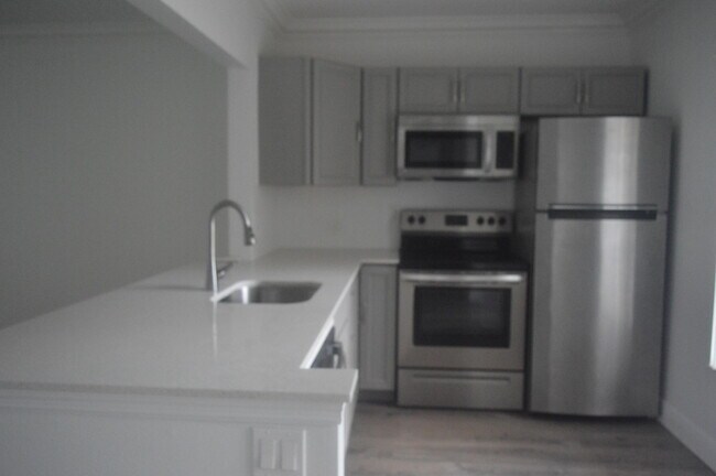 Building Photo - 6091 NW 61st Ave Unit 105