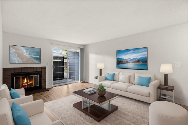 Step into this chic and cozy living room, perfect for relaxation and entertainment. - Monte Vista Apartments