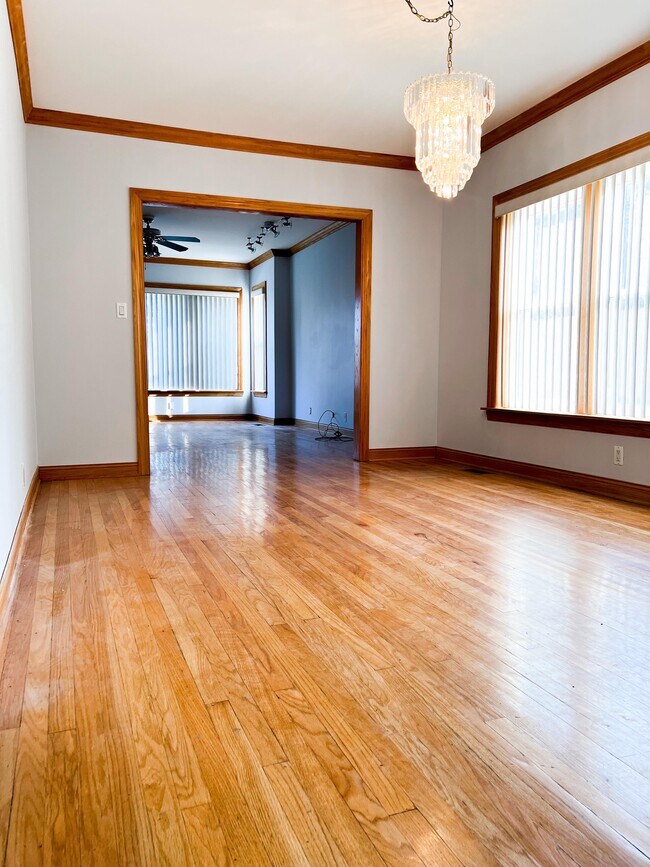 Dining room with hardwood floor - 6042 W Miami Ave Unit 1st