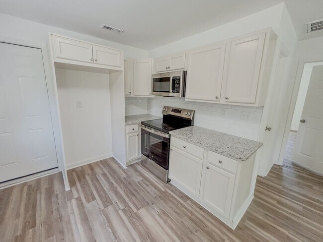 Photo - Modern 2BR/1.5BA Property with Renovated Interior and Unique Bonus Spaces