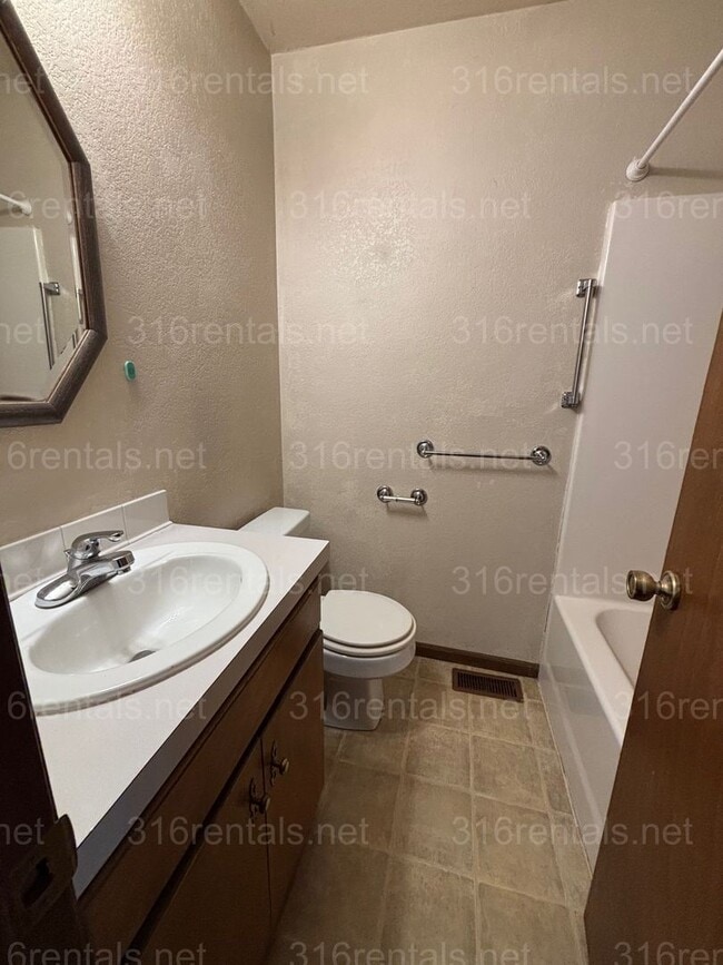 Building Photo - Three bed two bath house available now!