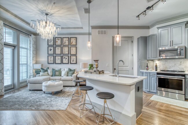 Chef-inspired kitchens feature granite and quartz countertops and stainless steel appliances