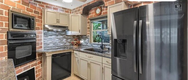 Photo - Charming 3-bedroom, 2-bath pool home available for move-in at the end of June.
