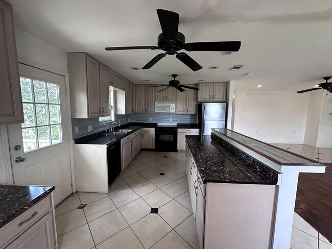 Photo - Spacious 4-Bedroom + Den Home with Modern Kitchen & Large Yard – Lehigh Acres