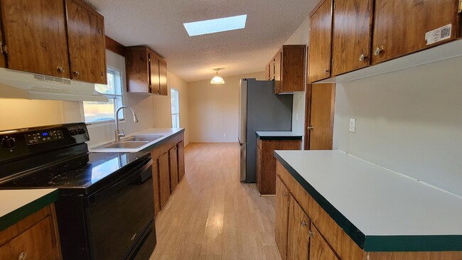 Photo - Huge 4 bedroom 2 bath home in a great family neighborhood.