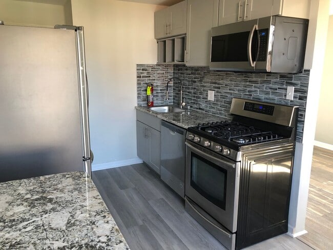 Photo - Twin Brick Home in Ridley SD! Granite and stainless kitchen! Renovated bathroom! Large rear fence...