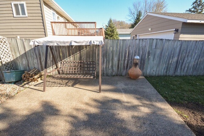 Photo - Ranch-style home with great fenced yard & patio!