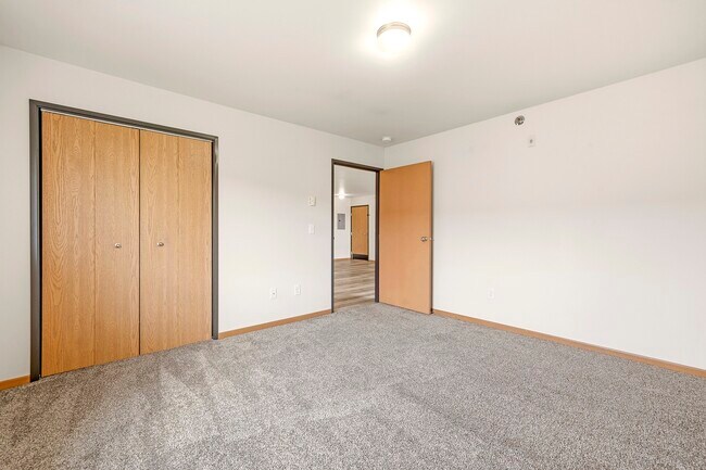 Step into the spacious living area of Paramount at the Bluffs Apartments, showcasing modern design with ample natural light. Enjoy a versatile layout perfect for your creative touches. Schedule a tour today and envision your new home!