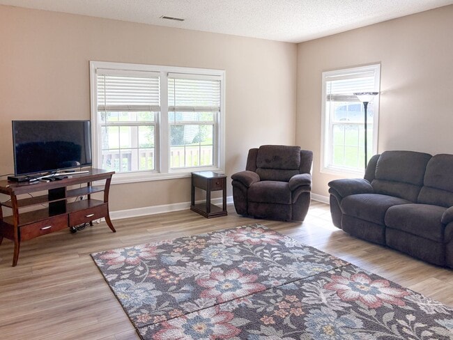 Photo - Fully Furnished 4-Bedroom Home with a Stocked Kitchen, Fenced Yard, and 2-Car Garage