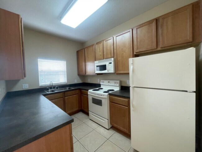 Photo - Spacious Gated Townhouse with Garage, Community Pool, and More!