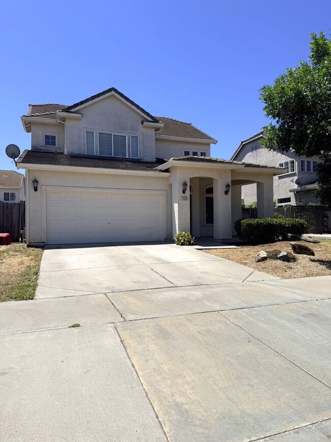 Building Photo - A must see 4/3 with a bedroom downstairs for convenience.